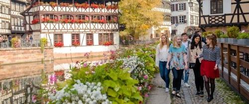 Students walking through Strasbourg historic buildings